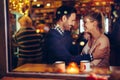Romantic couple dating in pub at night Royalty Free Stock Photo