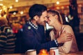 Romantic couple dating in pub at night Royalty Free Stock Photo