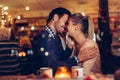 Romantic couple dating in pub at night Royalty Free Stock Photo