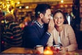 Romantic couple dating in pub at night Royalty Free Stock Photo