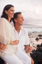 Romantic Couple Drinking Champagne on the Beach at Sunset Royalty Free Stock Photo