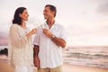 Romantic Couple Drinking Champagne on the Beach at Sunset Royalty Free Stock Photo