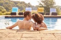 Romantic Couple Drinking Champagne In Swimming Pool On Vacation Royalty Free Stock Photo