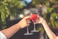 Romantic couple drinking cocktails in restaurant at the beach Royalty Free Stock Photo