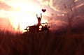 Romantic couple driving an old jeep car in grass field Royalty Free Stock Photo