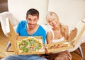 Romantic couple eating pizza at home Royalty Free Stock Photo