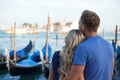 Romantic couple enjoying evening in Venice