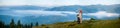 Romantic couple enjoying a morning haze over the mountains