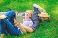 Romantic couple family enjoy leisure with poetry or literature grass background. Couple soulmates at romantic date Royalty Free Stock Photo