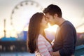 Romantic couple in front of santa monica at sunset Royalty Free Stock Photo