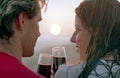 Romantic couple with goblet of wine on a beach Royalty Free Stock Photo