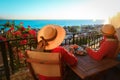 Romantic couple having breakfast on balcony terrace with sea view Royalty Free Stock Photo