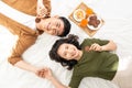 Romantic couple having breakfast lying in the bed at home Royalty Free Stock Photo