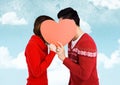 Romantic couple holding heart shape and kissing each other Royalty Free Stock Photo