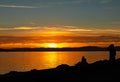 Couple. Sunset. Lake. Color. Silhouette Royalty Free Stock Photo