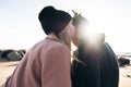 Romantic couple kissing on the beach on sunset. Soft sunny colors. Royalty Free Stock Photo