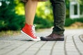 Romantic couple kissing outdoors - Lovers on a romantic date at sunset,girls stands on tiptoe to kiss her man - Close up Royalty Free Stock Photo