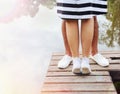 Romantic couple kissing on the pier near lake in summer day Royalty Free Stock Photo