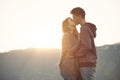 Romantic couple kissing at sunset Royalty Free Stock Photo