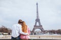 Romantic couple looking at Eiffel tower in Paris Royalty Free Stock Photo