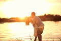 Romantic Couple In Love Embracing At Sunset At River