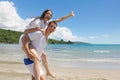 Romantic couple in love have fun on the beach with heart drawi Royalty Free Stock Photo