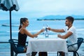 Romantic Couple In Love Having Dinner At Sea Beach Restaurant Royalty Free Stock Photo