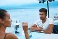 Romantic Couple In Love Having Dinner At Sea Beach Restaurant Royalty Free Stock Photo