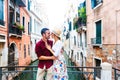 Romantic couple in love kissing in Venice, Italy - Tourists having fun on city street at holiday Royalty Free Stock Photo