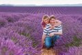 Romantic couple in love in lavender fields in Provence, France. Beautiful young man and woman hugging at sunset. Wedding Royalty Free Stock Photo