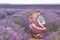 Romantic couple in love in lavender fields in Provence, France. Beautiful young man and woman hugging at sunset. Wedding Royalty Free Stock Photo