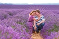 Romantic couple in love in lavender fields in Provence, France. Beautiful young man and woman hugging at sunset. Wedding Royalty Free Stock Photo