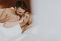 Romantic couple in love lying in bed together Royalty Free Stock Photo