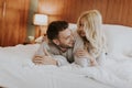 Romantic couple in love lying in bed together Royalty Free Stock Photo