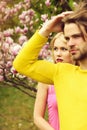 Romantic couple in love in spring garden at blooming magnolia Royalty Free Stock Photo