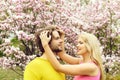 Romantic couple in love in spring garden at blooming magnolia Royalty Free Stock Photo