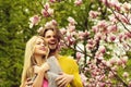 Romantic couple in love in spring garden at blooming magnolia Royalty Free Stock Photo