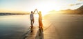 Romantic couple, man and woman holding hands enjoying sea sunset on beach during travel holidays vacation. Love, getaway, Royalty Free Stock Photo