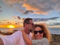 Romantic couple of man and woman in love taking selfie picture together hugging and smiling at the phone camera and enjoying Royalty Free Stock Photo