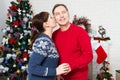 Romantic Couple Near Christmas Tree Hugging And Enjoying Celebration Holidays