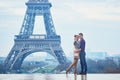 Romantic couple near the Eiffel tower in Paris, France Royalty Free Stock Photo