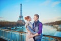 Romantic couple near the Eiffel tower in Paris, France Royalty Free Stock Photo