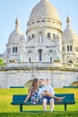 Romantic couple near Sacre-Coeur cathedral on Montmartre, Paris Royalty Free Stock Photo