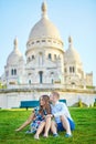 Romantic couple near Sacre-Coeur cathedral on Montmartre, Paris Royalty Free Stock Photo