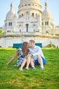 Romantic couple near Sacre-Coeur cathedral on Montmartre, Paris Royalty Free Stock Photo