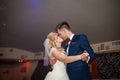 Romantic couple of newlyweds first elegant dance and kiss at wed Royalty Free Stock Photo