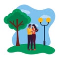 romantic couple in the park with lamp post and tree Royalty Free Stock Photo