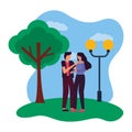 romantic couple in the park with lamp post and tree Royalty Free Stock Photo