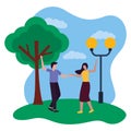 romantic couple in the park with lamp post and tree Royalty Free Stock Photo