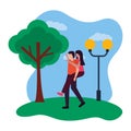 romantic couple in the park with lamp post and tree Royalty Free Stock Photo